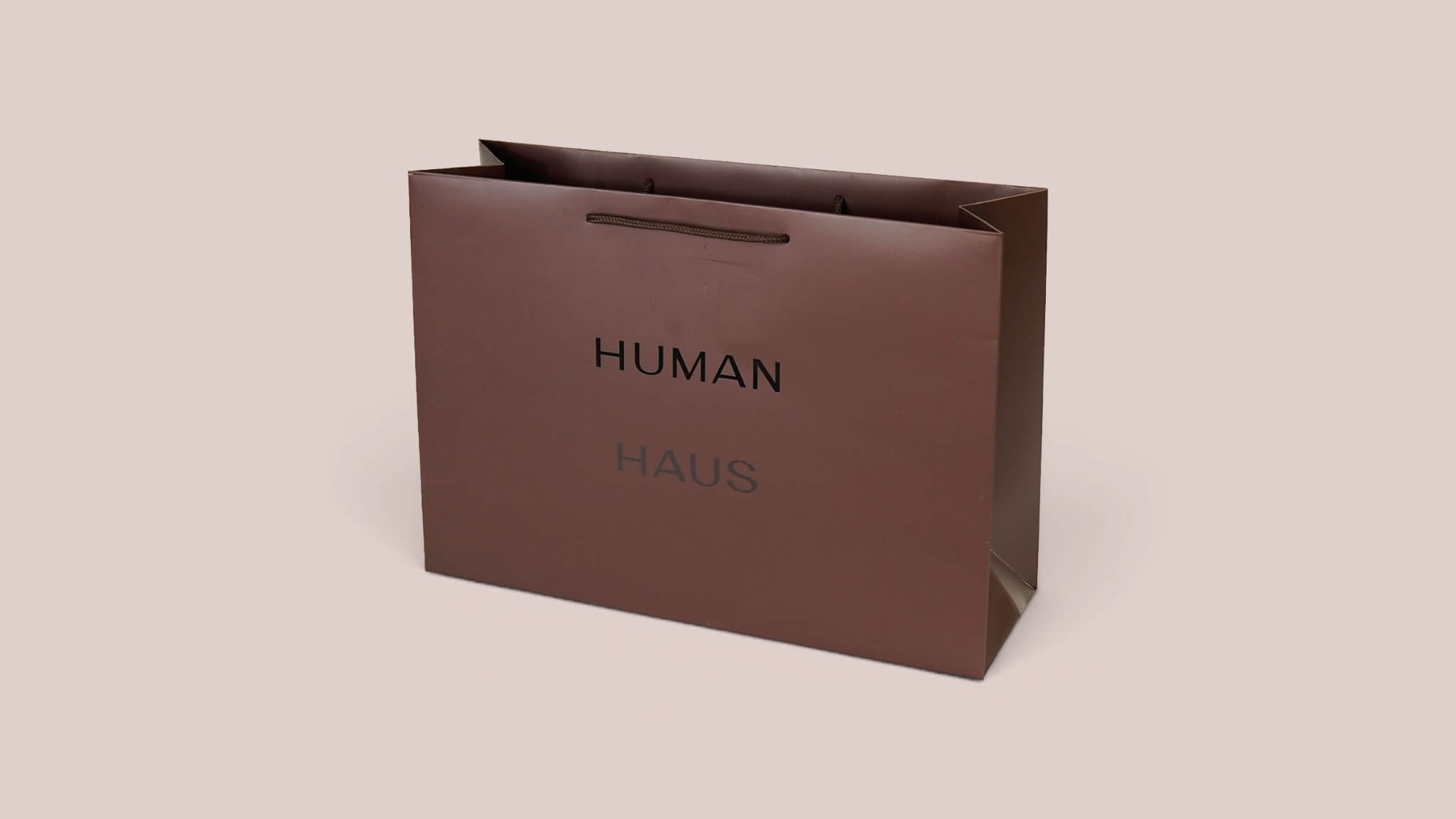 Dark brown HUMAN HAUS premium paper bag