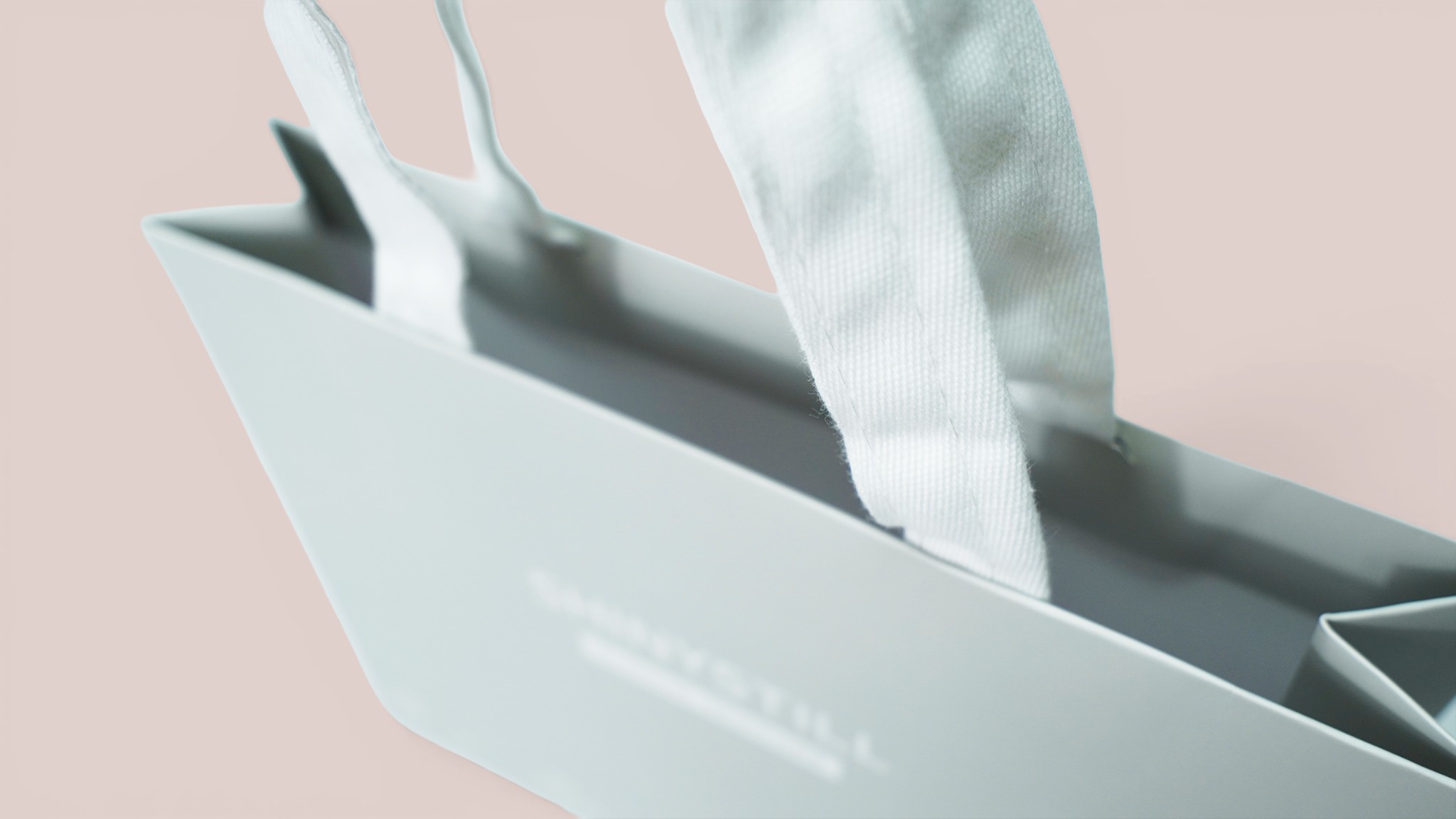 Premium paper bag with hidden handle option